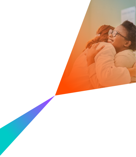 A young woman hugging her doctor during a consultation